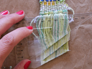 Fringe rows trimmed at angle for DIY woven statement necklace. @FanningSparks