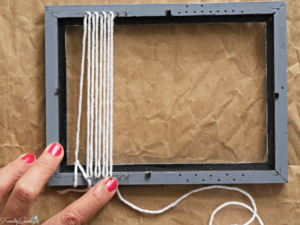 Warping the loom with cotton yarn is the first step in this DIY woven statement necklace. @FanningSparks