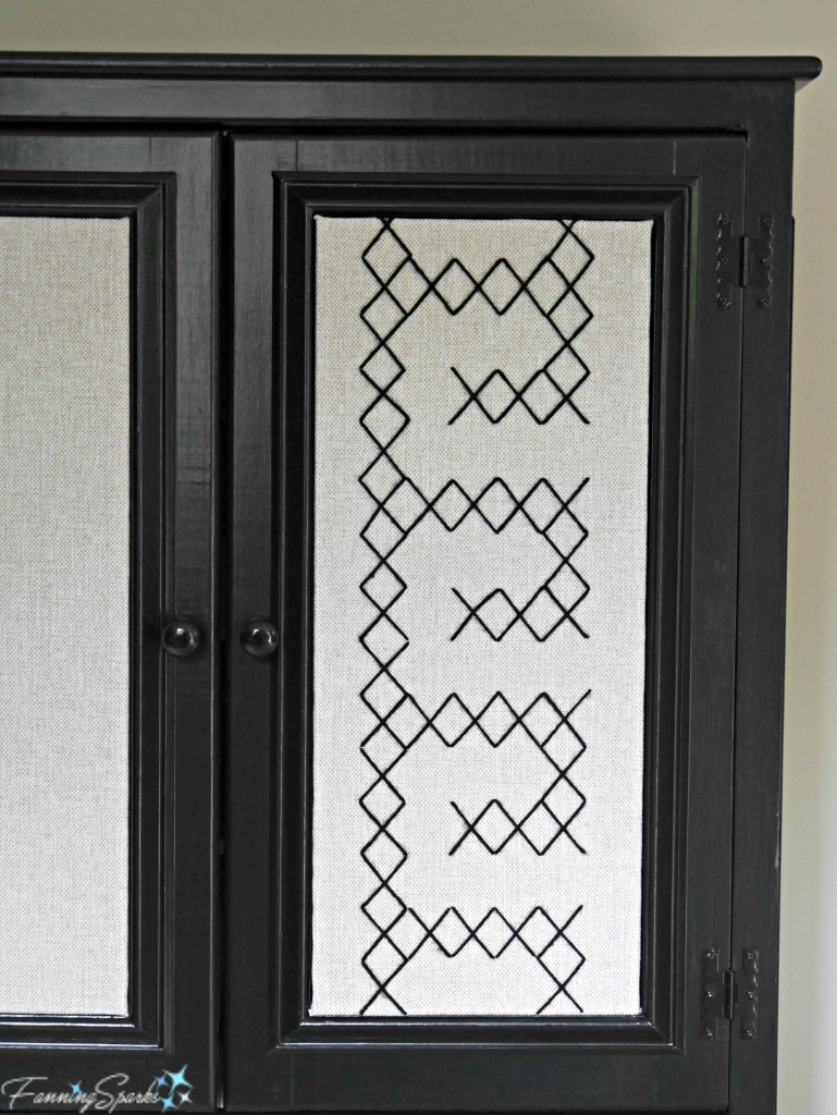 Maker's Cabinet showcasing extra-large cross-stitched front door panel. @FanningSparks