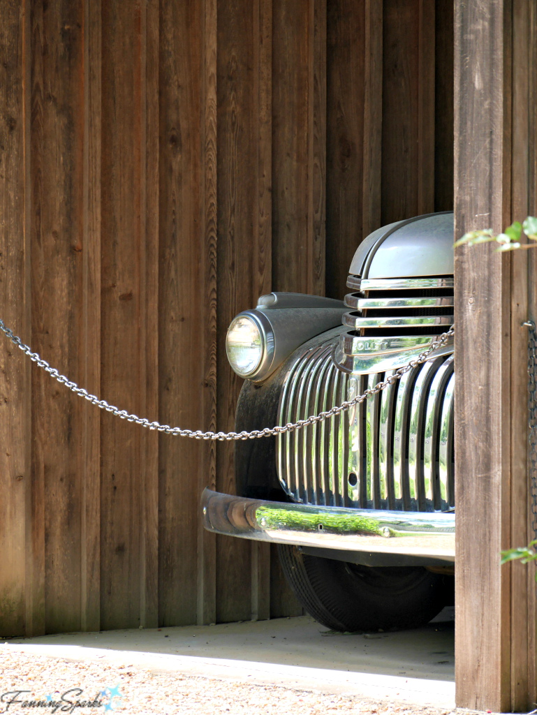 Curvaceous lines of a vintage truck peeking out of a shed. @FanningSparks