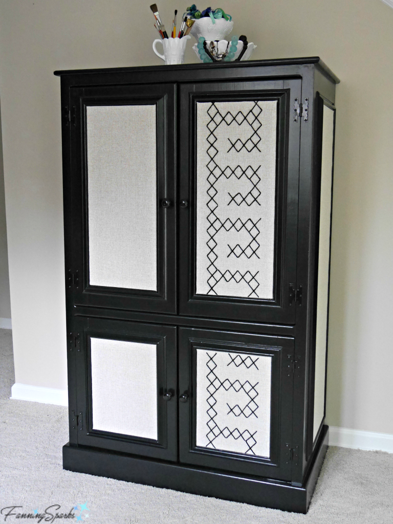 Maker's Cabinet showcasing extra-large cross stitch panel design on front doors. @FanningSparks