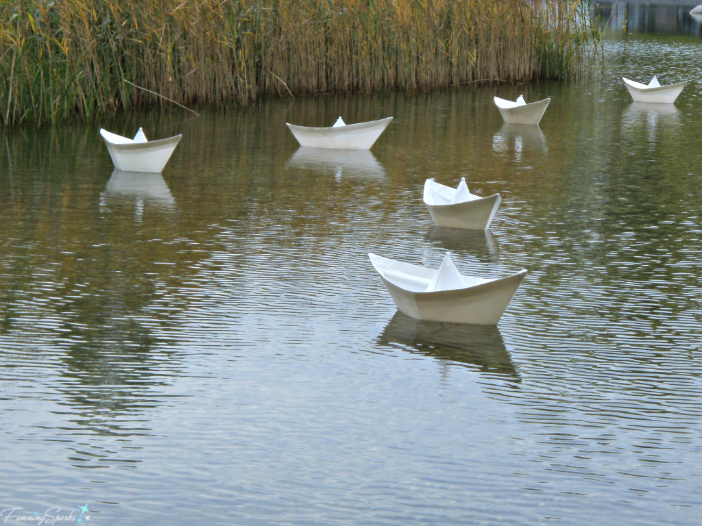 Paper boats floating on naturalistic pond in Berlin Germany @FanningSparks