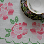Cross stitched roses on vintage dresser scarf @FanningSparks