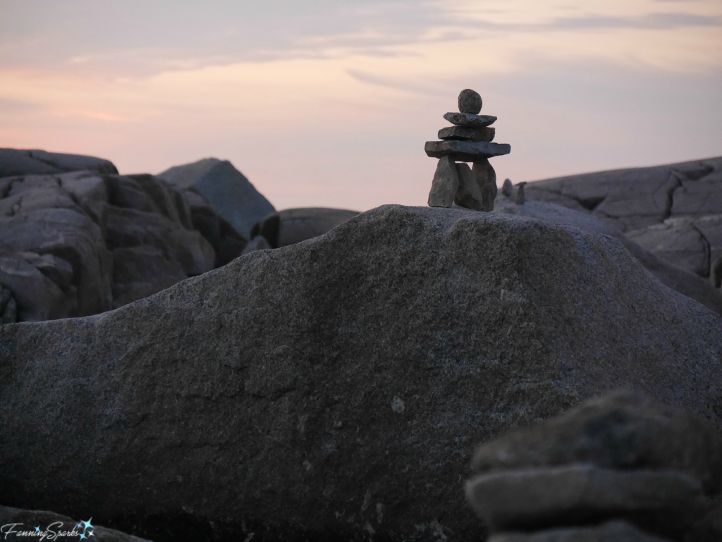 Inukshuk on the granite boulders of Peggy's Cove during magic hour. @FanningSparks