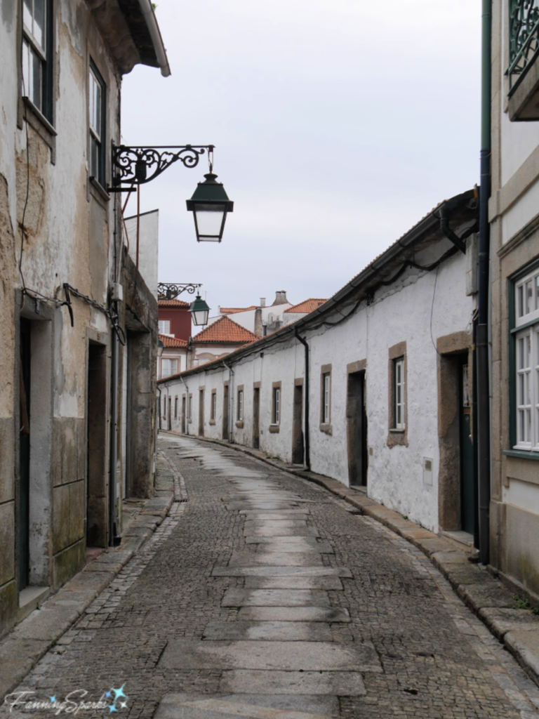 Wrought Iron Light Fixtures Grace Quiet Street in Vila do Conde Portugal.  @FanningSparks