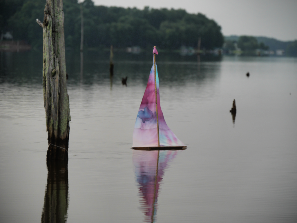 Red and Blue Landlubber Toy Sailboat on Lake Oconee   @FanningSparks