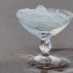 Frosted Clear Sea Glass Showcased in Wine Glass on Beach @FanningSparks