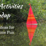 Red, Orange and Yellow Striped Sailboat in Lake Oconee @FanningSparks