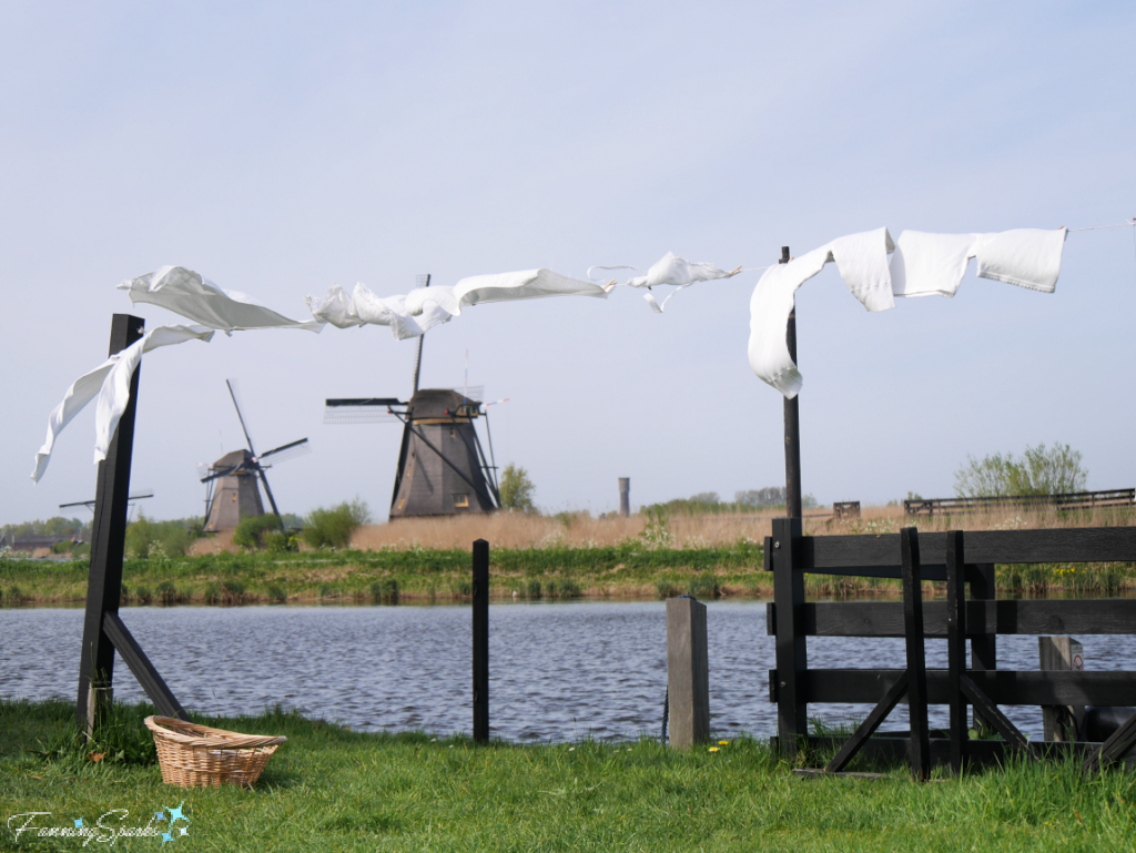 Laundry on Clothesline in Front of Windmills at Kinderdijk @FanningSparks