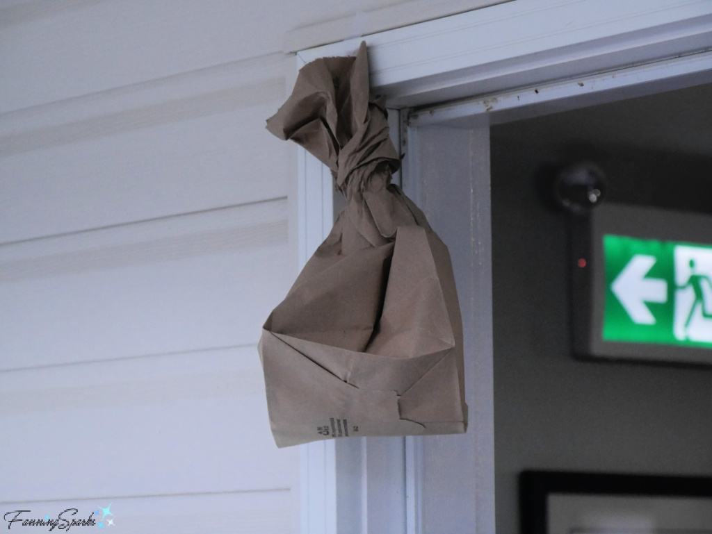 Brown Paper Bag in Rocky Harbour Restaurant Doorway @FanningSparks