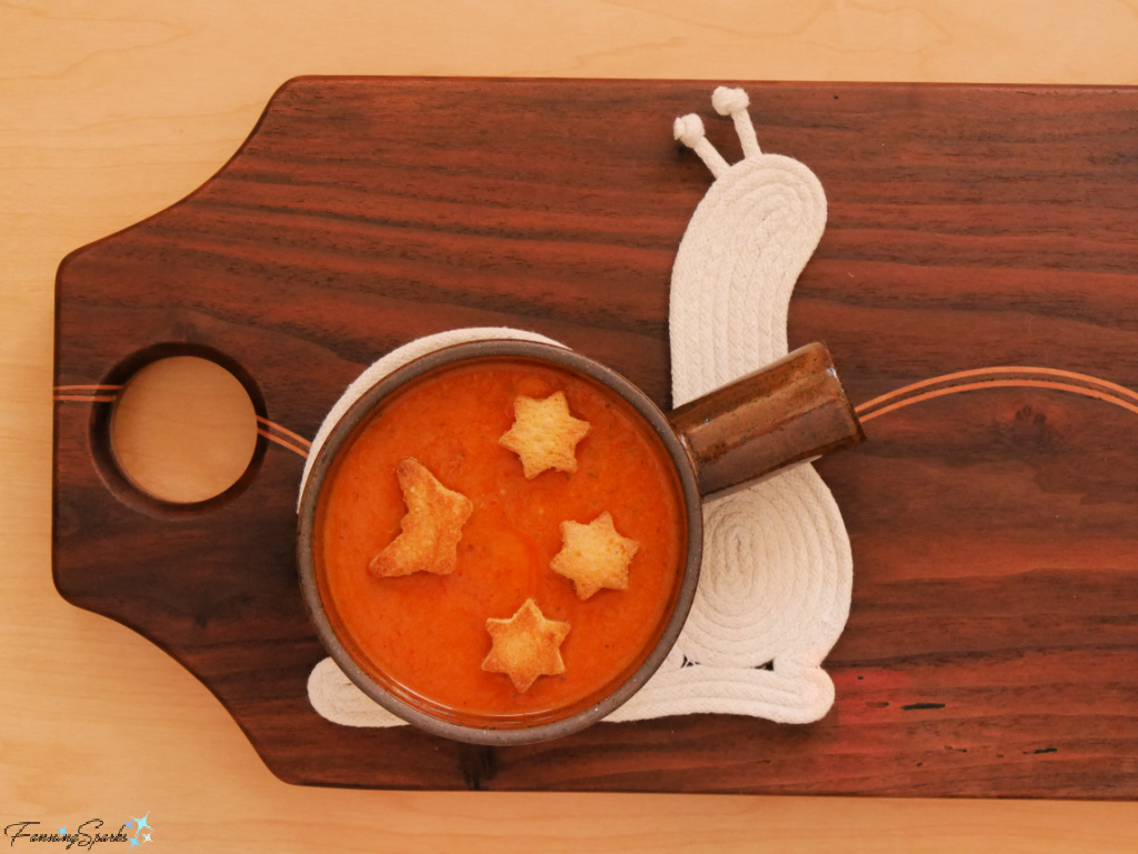 Snail-Shaped Rope Coaster with Bowl of Tomato Soup on Wooden Board @FanningSparks