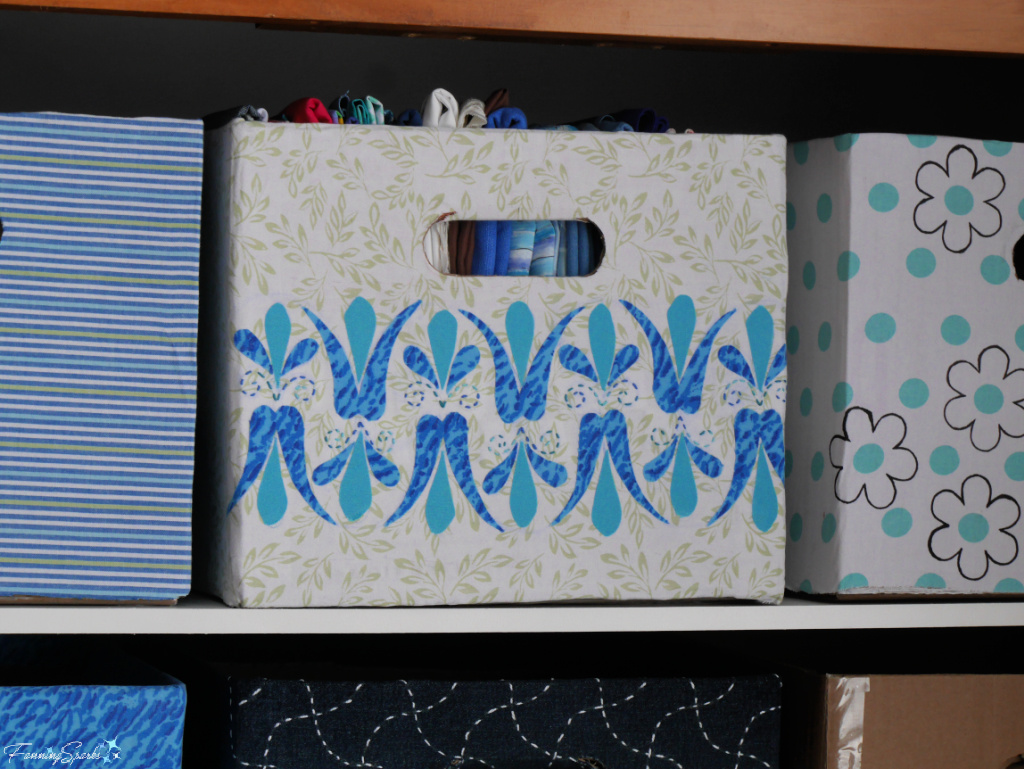 Repurposed Cardboard Storage Bin with Tulip Applique in Cabinet   @FanningSparks