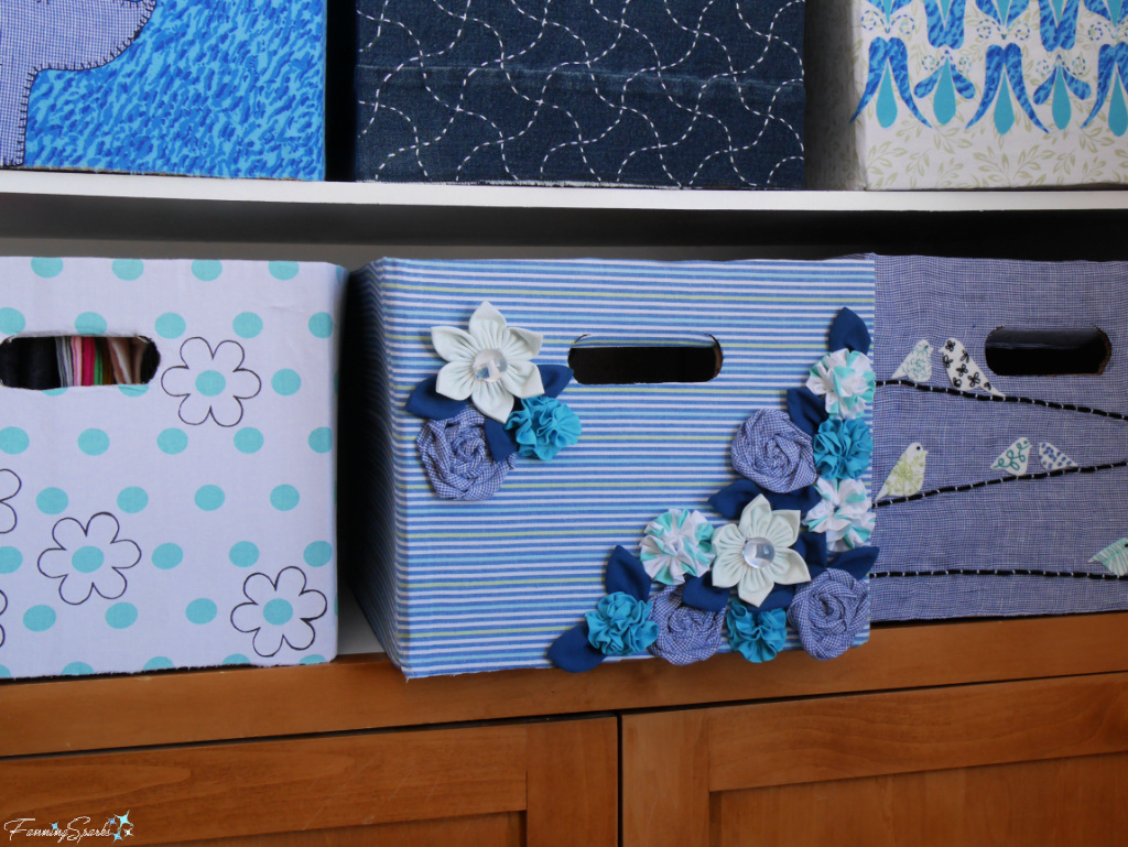 Repurposed Cardboard Storage Bin with Fabric Flowers in Cabinet   @FanningSparks