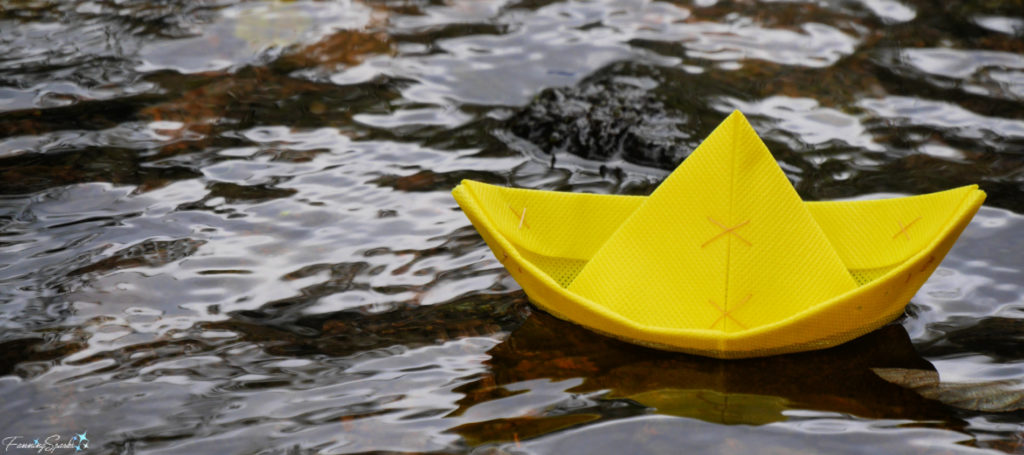 Yellow Folded Boat Sailing Smoothly on Stream @FanningSparks